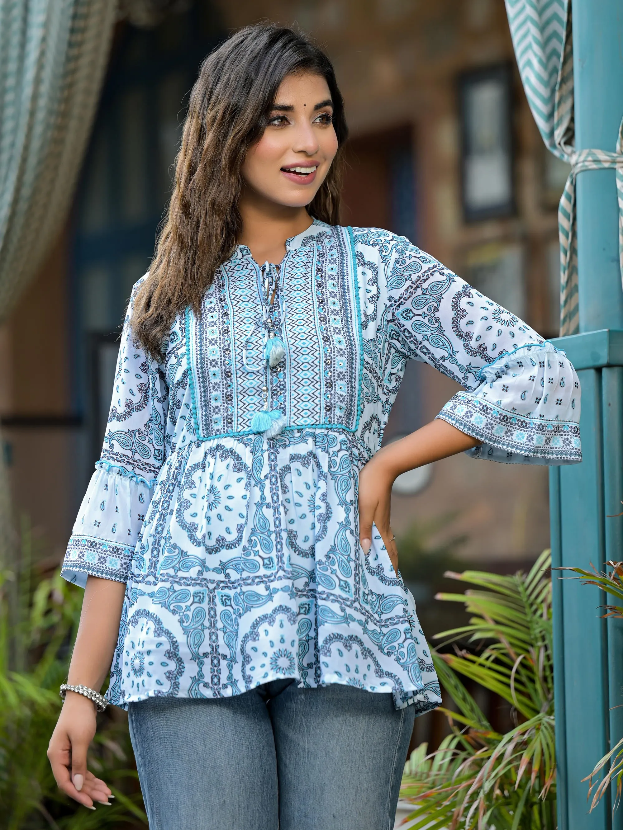 Sky Blue Ethnic Motif Printed Georgette Lacy Tunic With Tassels & Sequins